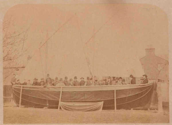 Testing the number of people who can fit in a Berthon lifeboat and a smaller version in front.