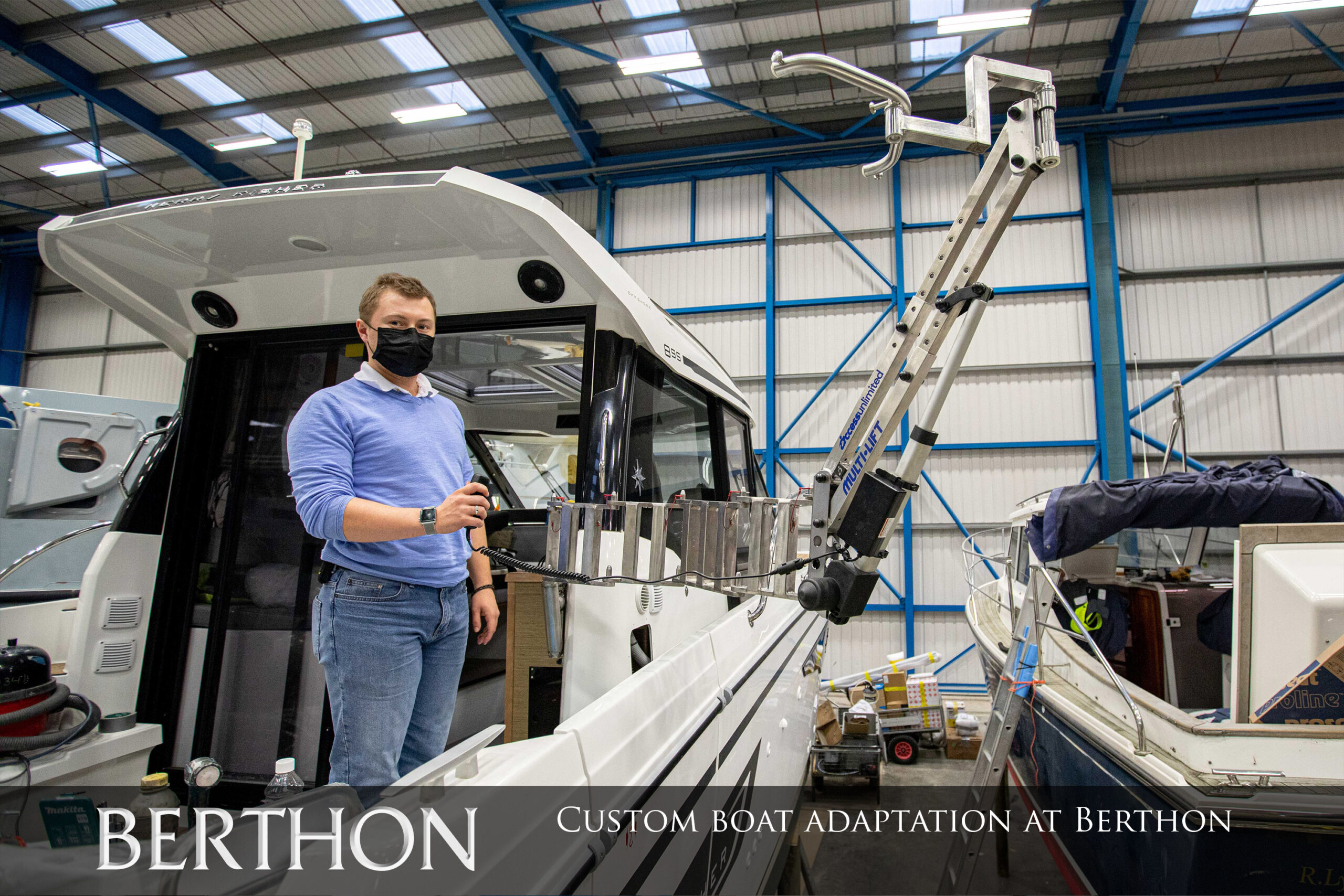 Project Manager Ben Slater next to Custom boat adaptation arm