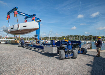 Motorboat being lifted off one of Berthon's boat movers